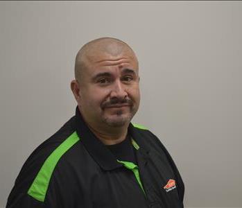 a man in front of a grey background