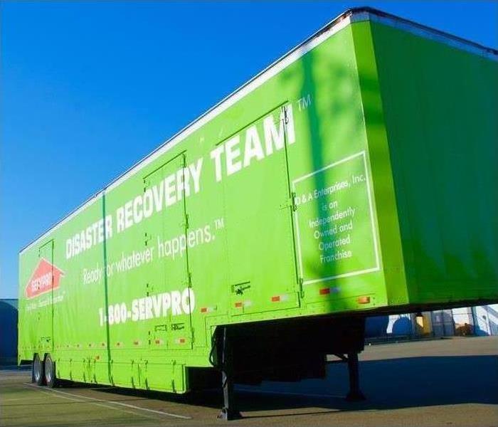 Green large tractor trailer, SERVPRO disaster recovery team