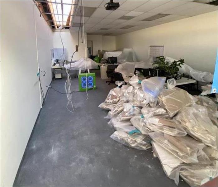 ceiling tiles removed for an office, plastic bags full with ceiling tiles , ozone generator 